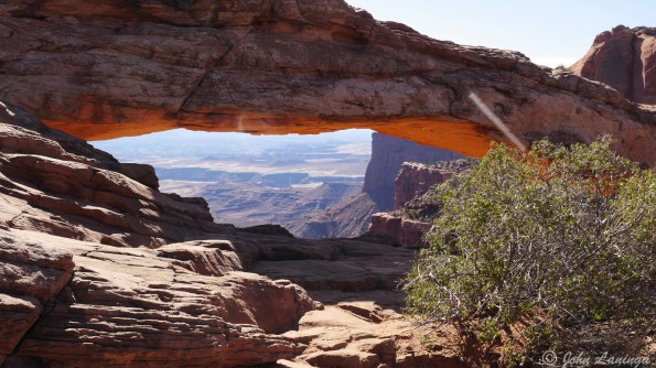 The sun is striking the underside of Mesa Arch