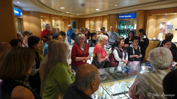 Romola getting caught up in the shopping frenzy.  She doesn't spend much, though.