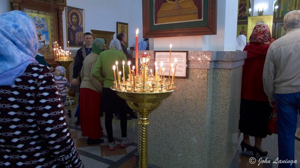 Lighting candles in the church