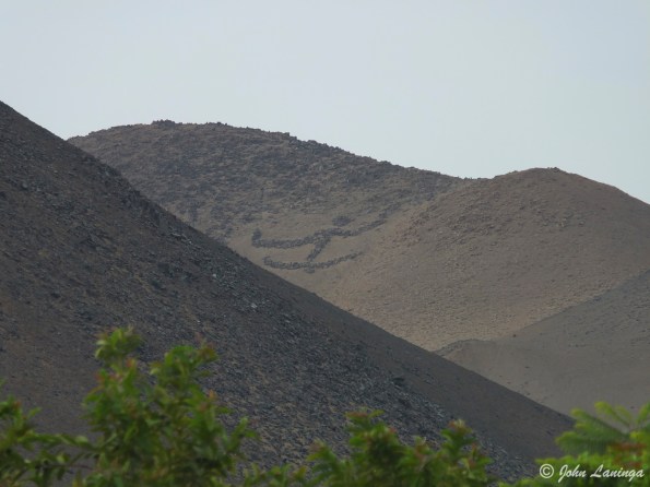 Enormous geoglyphs in the distant mountains